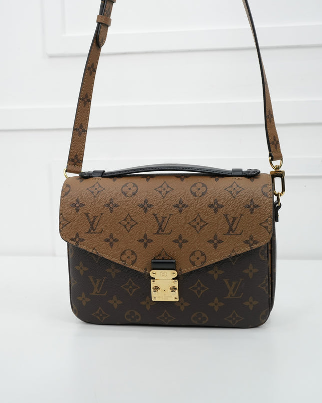 MONOGRAM REVERSE POCHETTE METIS MM
