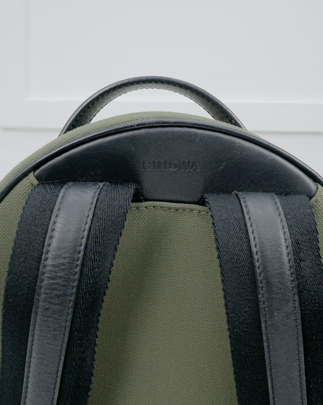 NEVER STILL BACKPACK OLIVE GREEN LEATHER-TRIMMED CANVAS