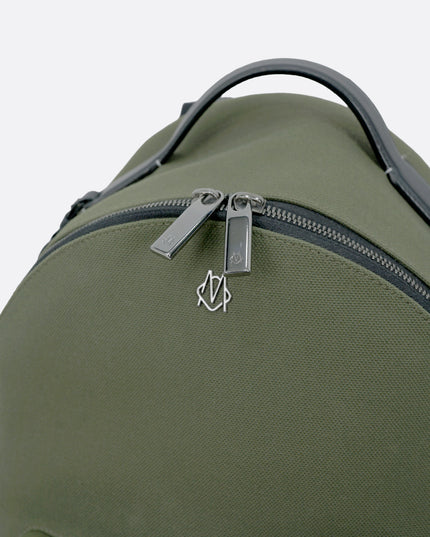 NEVER STILL BACKPACK OLIVE GREEN LEATHER-TRIMMED CANVAS