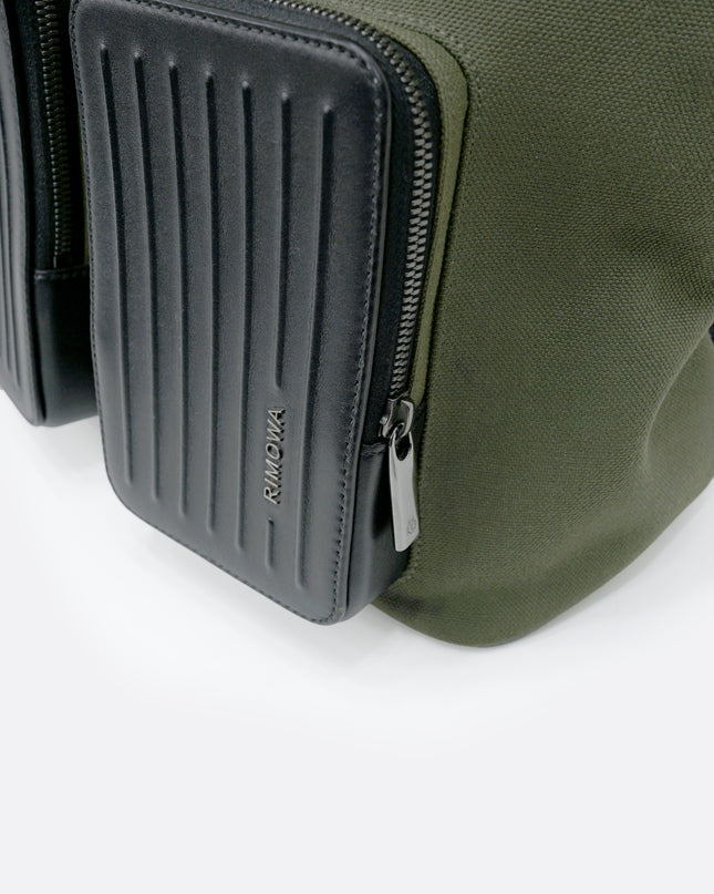 NEVER STILL BACKPACK OLIVE GREEN LEATHER-TRIMMED CANVAS