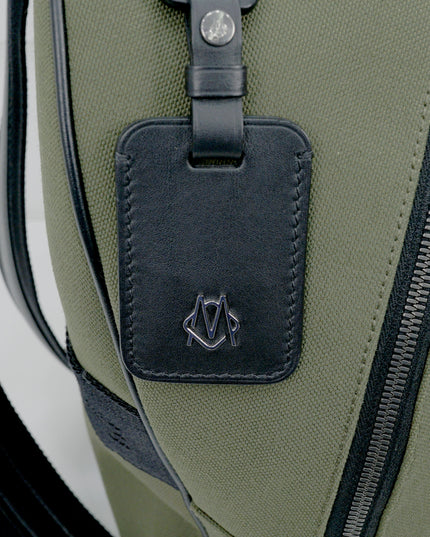 NEVER STILL BACKPACK OLIVE GREEN LEATHER-TRIMMED CANVAS