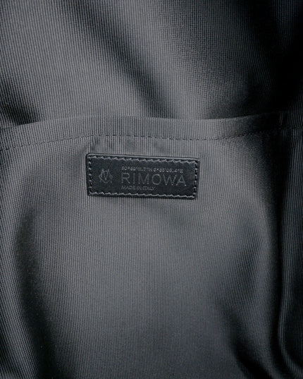 NEVER STILL BACKPACK OLIVE GREEN LEATHER-TRIMMED CANVAS